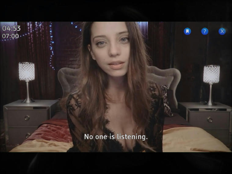 A scantily clad women sitting on a bed looking into the camera. The subtitles at the bottom of the screen read: "No one is listening."